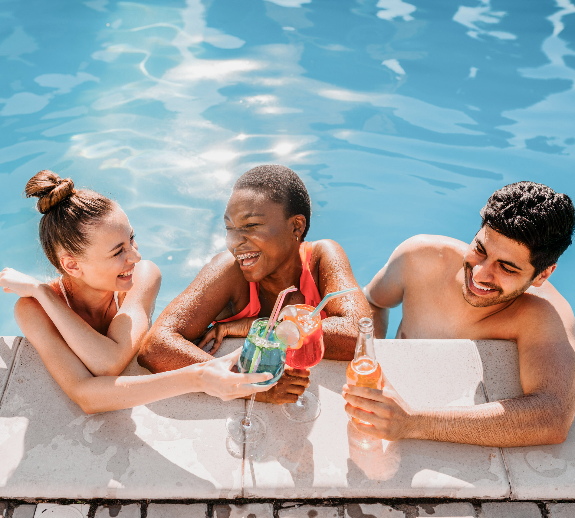 3 friends relax by a Bluefino bespoke pool